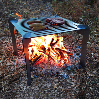Volcann Ferox Open Fire Grill & Cooktop in an outdoor setting