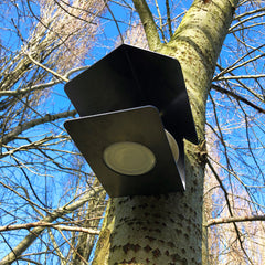 Bottom view of the feeder showing a dish slotting into the small recess at the base.