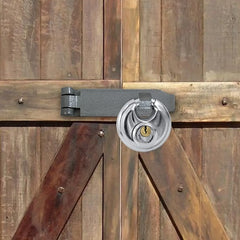 Shed and gate door locked securely with a discus padlock