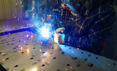 Welder hard at work welding components together