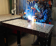 Welder using the welding table to weld components together