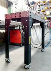 Welding Table placed in front of a tool wall in a production environment