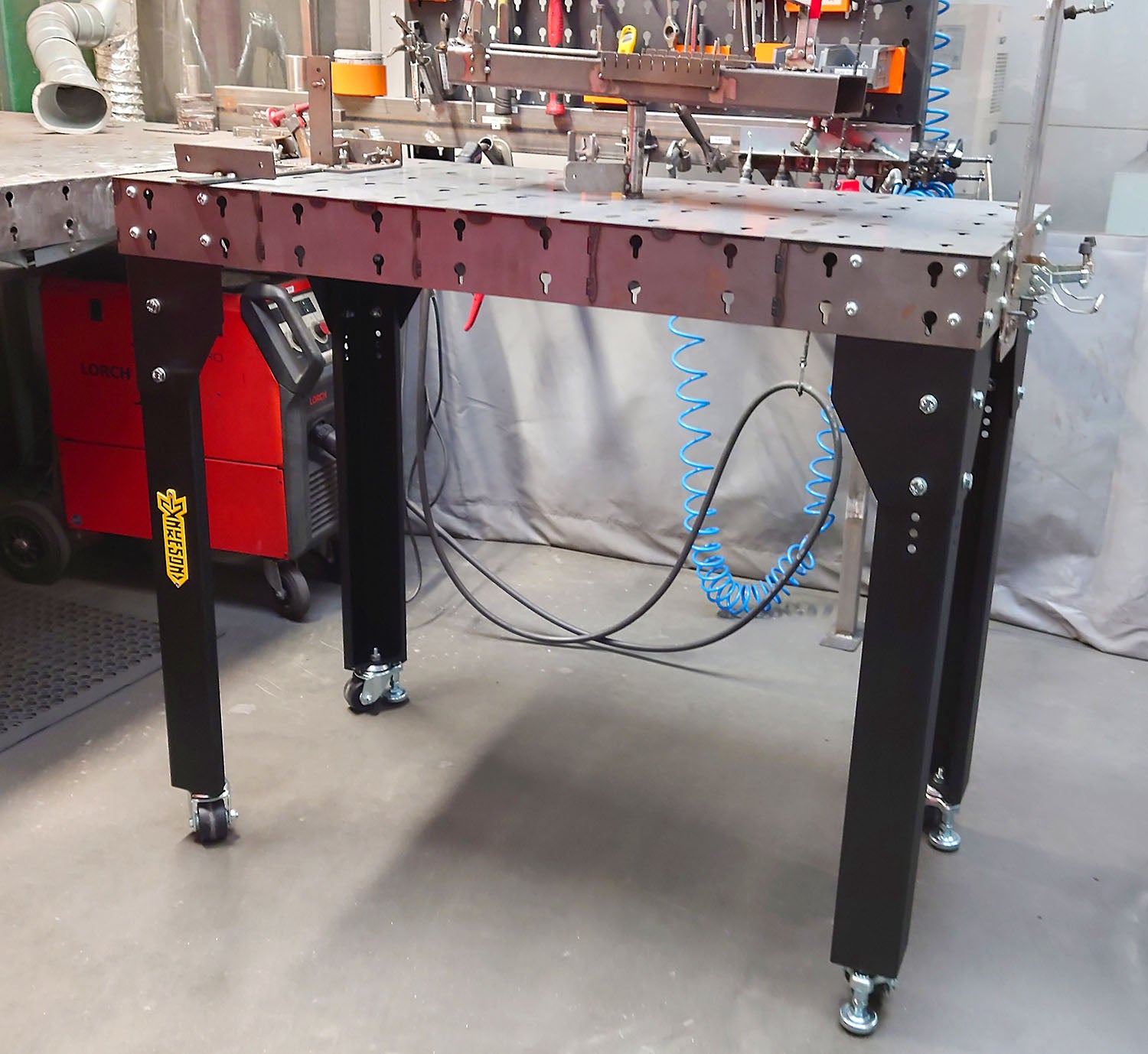 Square shot of the Modular Welding Table in a welding environment