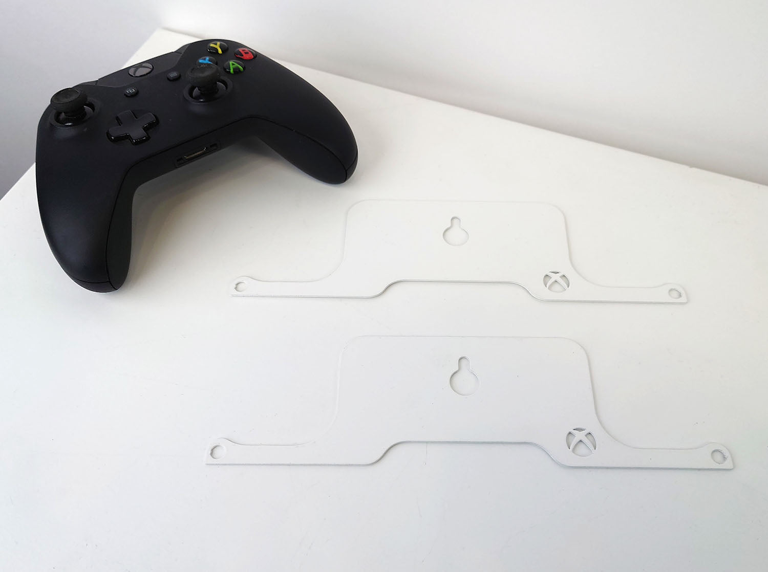 Controller next to flat-packed brackets, ready for assembly