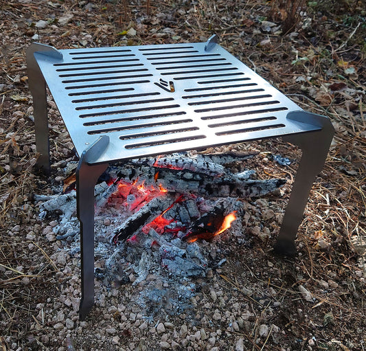Volcann Ferox Open Fire Grill & Cooktop in an outdoor setting