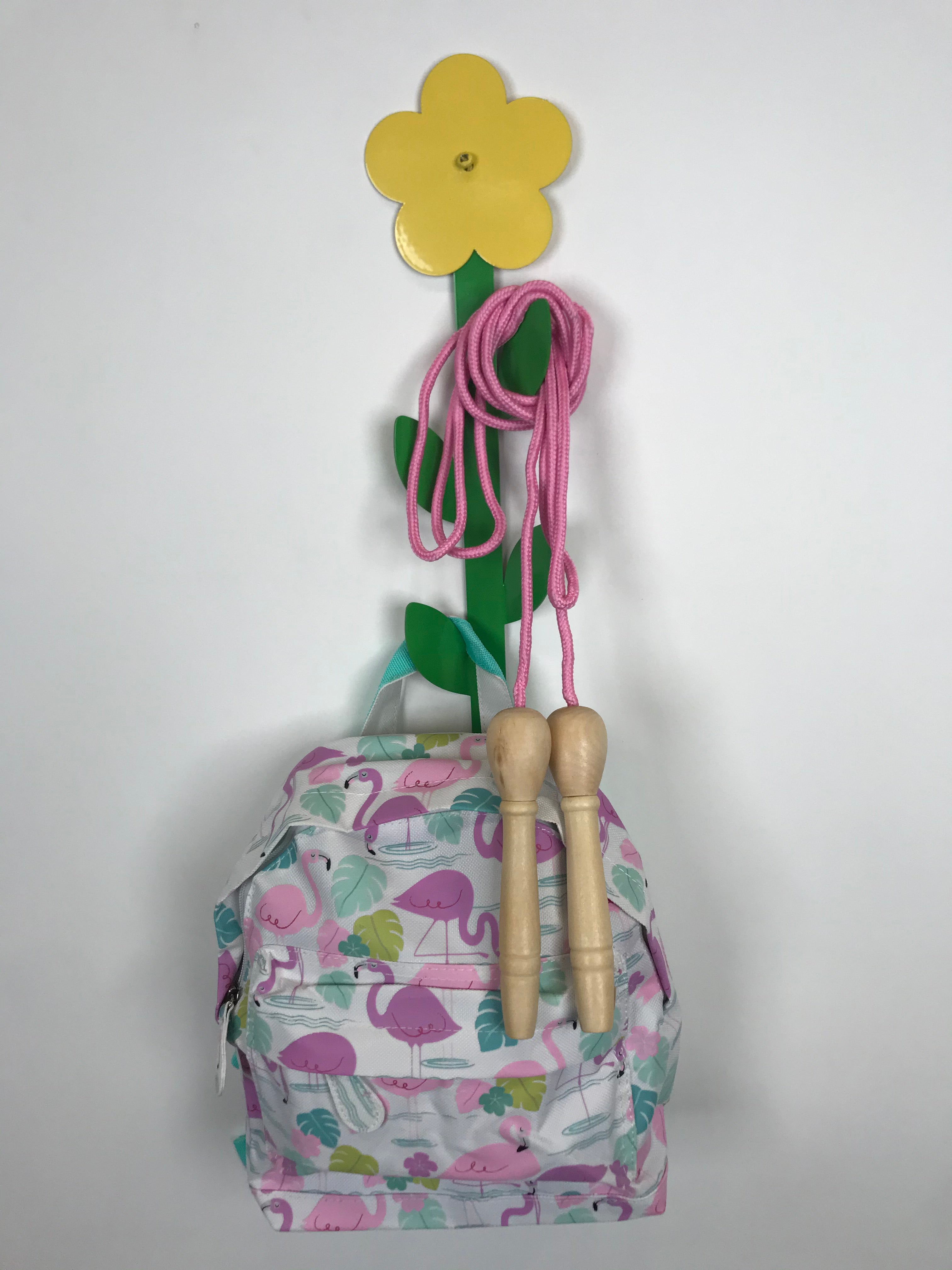 Flower shaped coat holder with items dangling