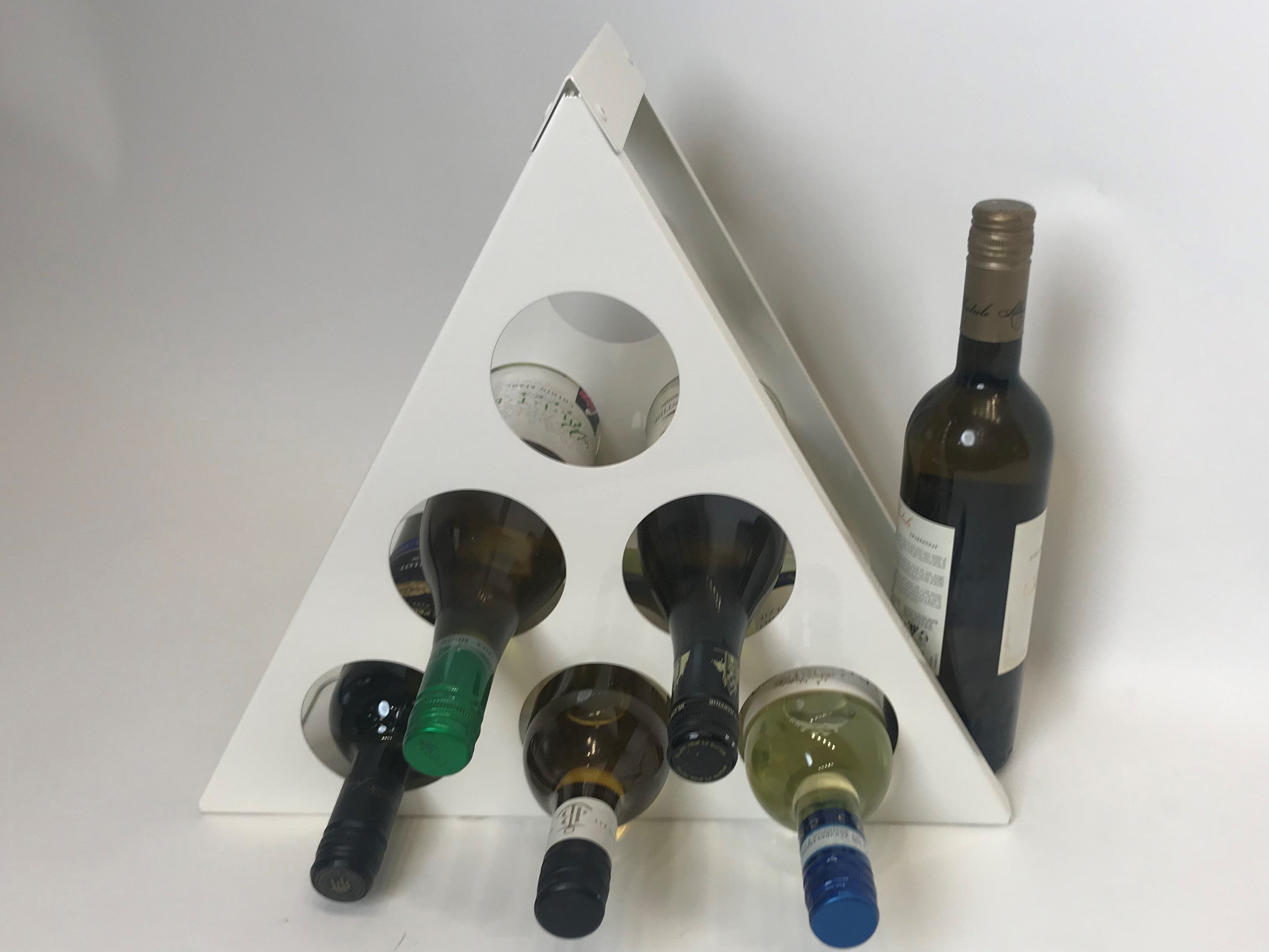 Pyramid Wine Rack with 5 Bottles of Wine in a kitchen setting with an additional bottle to the side, wide angled shot