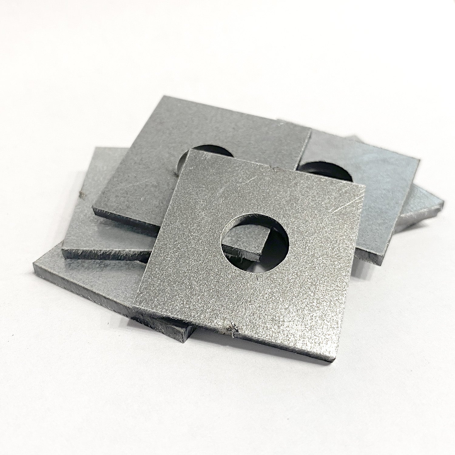 Square Washers on a pile with a white background