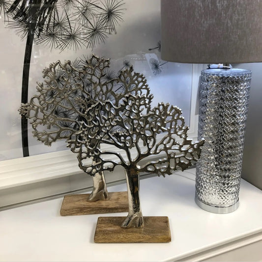 Tree of Life Statues on Sideboard with Lamp