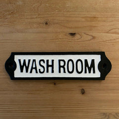 Closeup view of cast iron Washroom sign