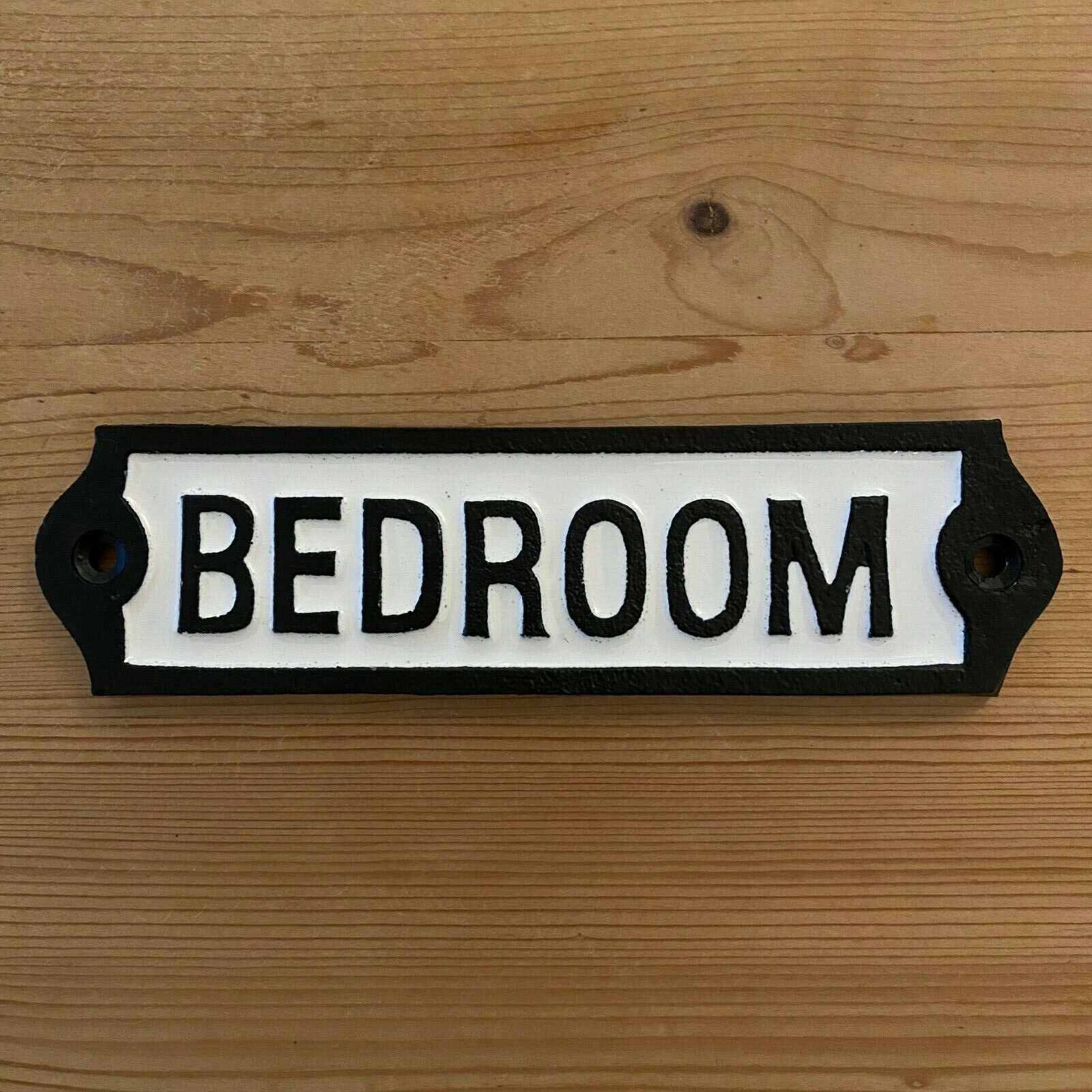 Closeup view of cast iron Bedroom sign
